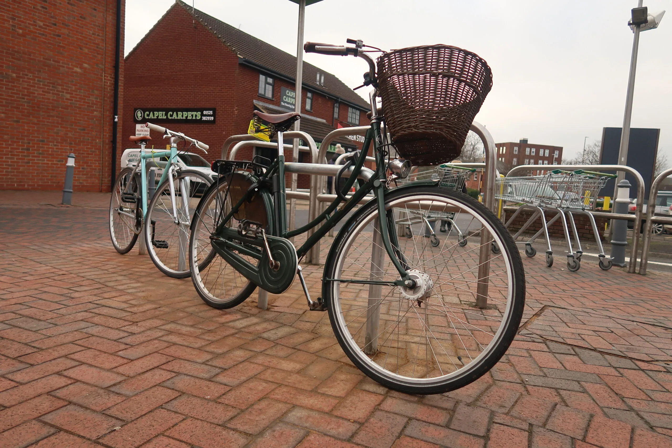 Two Bikes parked outside Waitrose Leighton Buzzard on the new cycle stands